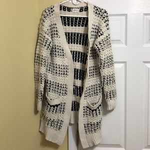 Black and cream colored cardigan